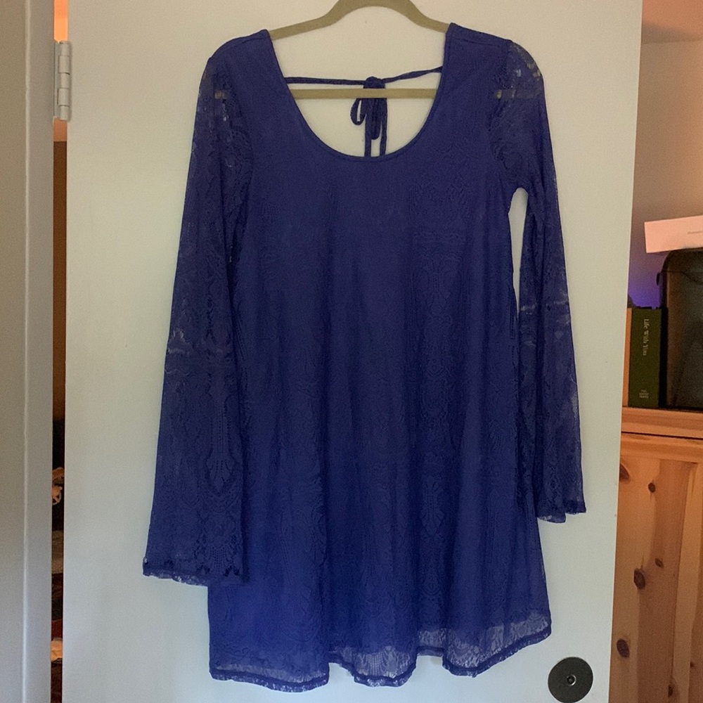 Blue/ periwinkle mini dress from altar’d state. Lace overlay. Tie back